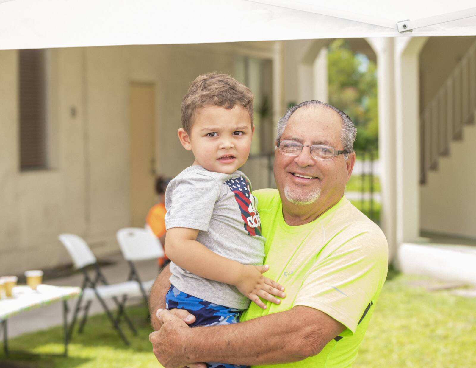 Grandfather holding grandson